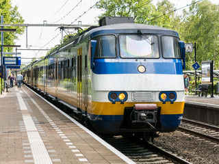 Sprinter train on railway station in Hilversum, the Netherlands