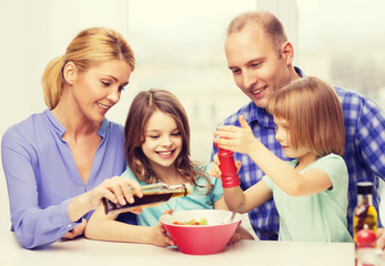 happy family with two kids eating at home
