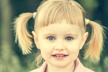 Fototapeta premium Cute little girl on the meadow 
