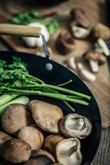 shitake mushroom prepare for cooking on wok and chopping block