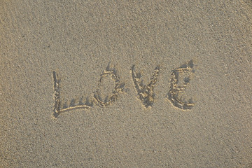 Love written in sandy beach