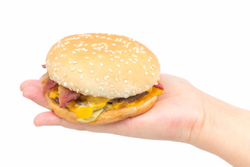 Burger on female hand with isolated background.
