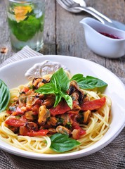 pasta with mussels, pepperoni, bacon, tomato and basil