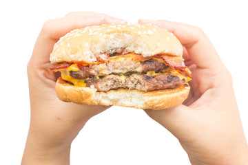 Female hand holding burger in isolate background.