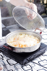 Chef open the lip of pan for cooking Japanese pork curry