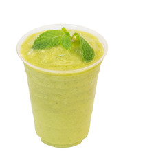 cold fresh mango with peppermint smoothie in takeaway glass isol