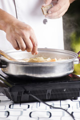 Chef putting Japanese curry paste for cooking