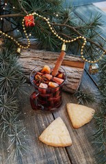 cup of hot chocolate with marshmallows and a scarf