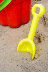 Fototapeta na wymiar Children's bucket and shovel in the sand