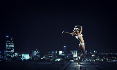 Fototapeta na wymiar Girl dancing in dark