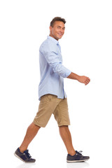 Young Man Walking. Full length studio shot isolated on white.