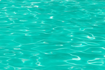 green pool water with sun reflections