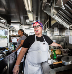 Fototapeta na wymiar Female Chef on Food Truck