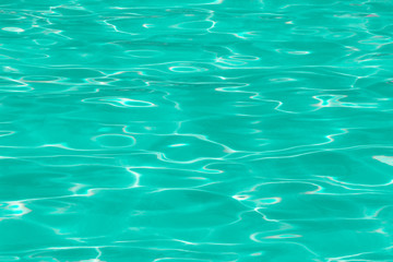 green pool water with sun reflections