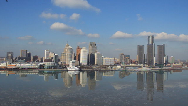 Detroit Skyline Afternoon 1. Detroit skyline during a cold winter afternoon with ice chunks floating down the Detroit River.