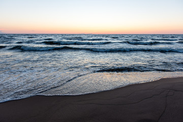 red dramatic sunset on the sea beach