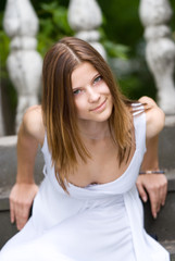 Smiling lady in white dress