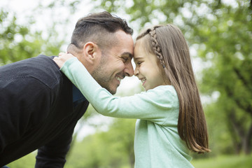 Fototapeta premium Father and daughter in forest on a meadow