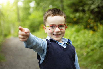 Naklejka premium Portrait of cute little boy child outdoors on the nature