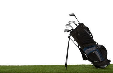 Golf bag and clubs on grass side view isolated on white