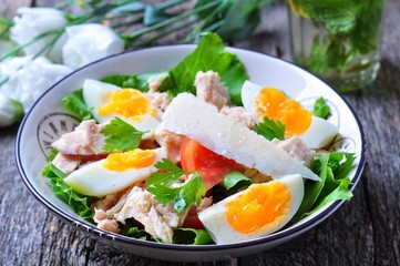 salad with tuna, tomatoes, boiled eggs and parmesan cheese