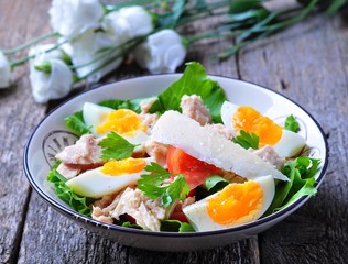 salad with tuna, tomatoes, boiled eggs and parmesan cheese