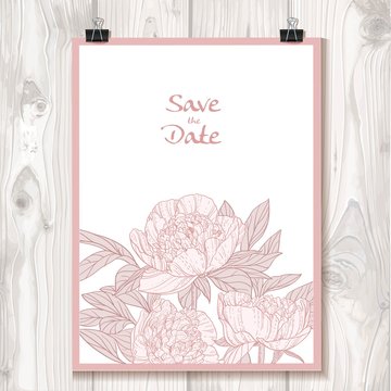 Invitation with peonies hanging on binder on a background textur