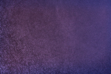 abstract dark bokhe lights background , purple,black and subtle gold. defocused background
