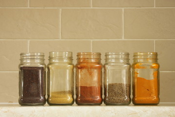 Brown mustard seeds in a jar