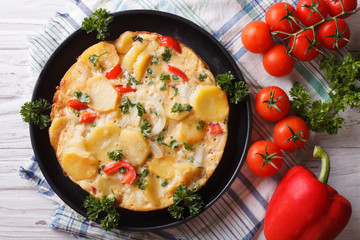 Hot Spanish Omelette on a pan close-up. horizontal top view
