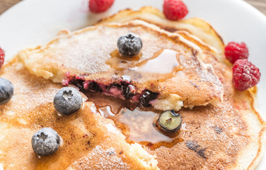 Pancakes with maple syrup and fresh berries