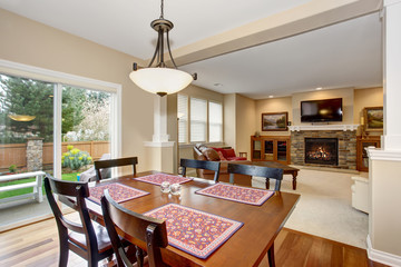 Simple dinning area with colorful place matts.
