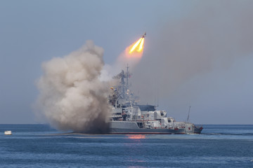 A missile frigate of the Russian Navy makes missile launch during Marine Parade on the Navy day...