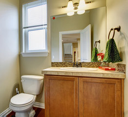 Small half bathroom with nice decor.