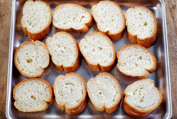 bread slices on oven pan