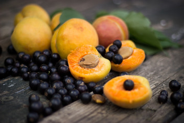 fresh apricots, black currant in a glass bowl transparent scatte