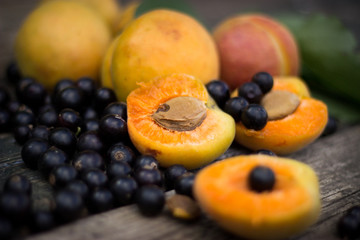 fresh apricots, black currant in a glass bowl transparent scatte