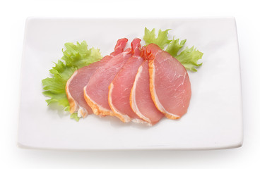 Slices of pork balyk on the plate