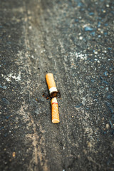 Cigarette butts on the dirty floor