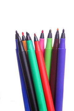 Couple of Colorful sketch pen are arranged vertically and made standing , photographed against white background