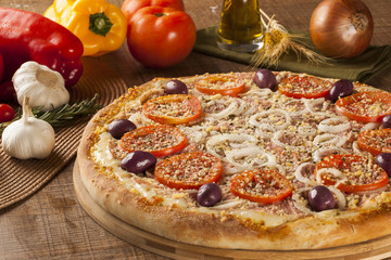 ham and tomato pizza  on the table