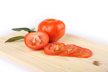 slices of tomatoes on a wooden board