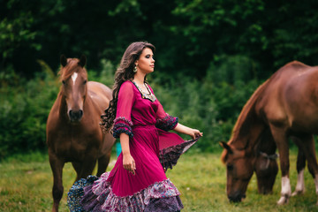 Beautiful gypsy in violet dress - obrazy, fototapety, plakaty