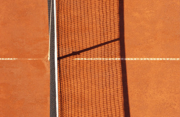 Tennis net on a tennis clay court