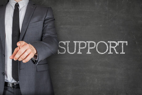 Support on blackboard with businessman