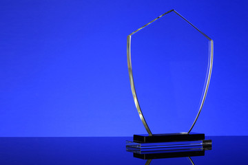 glass trophy in blue background