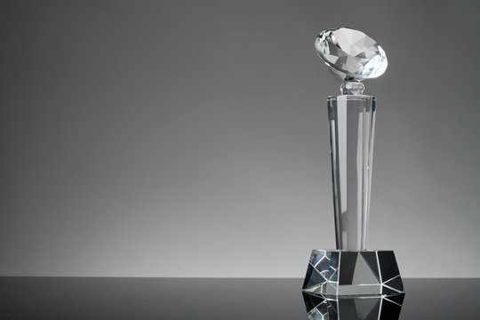 glass trophy in gray background