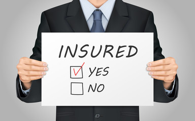 businessman holding yes insured poster