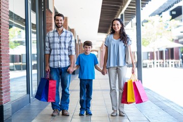 Happy family with shopping bags