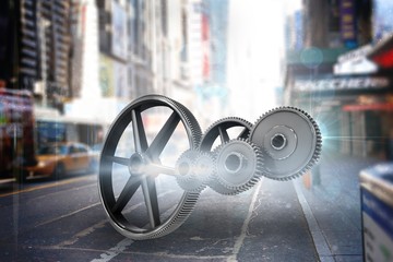 Composite image of metal cogs and wheels connecting